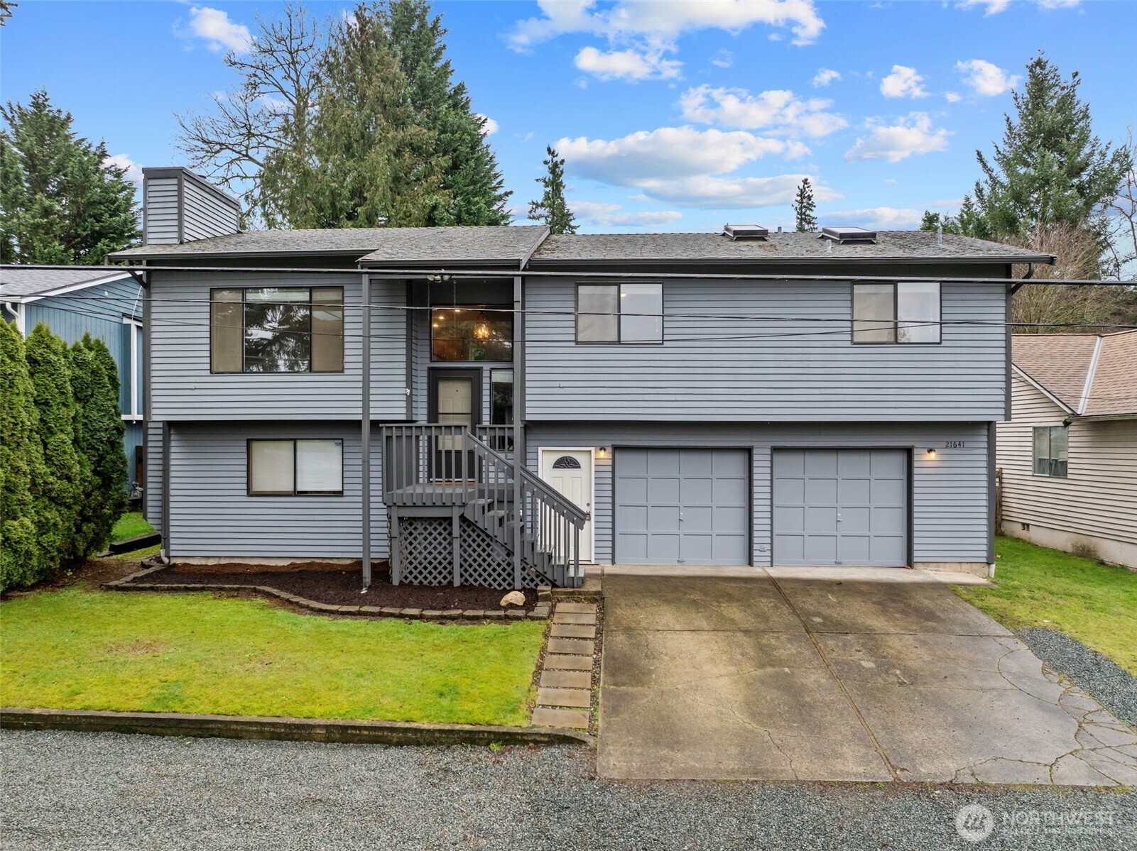 21641 Southeast 266th Street Maple Valley, WA 98038 - Photo 2 of 40 a house view with a garden space