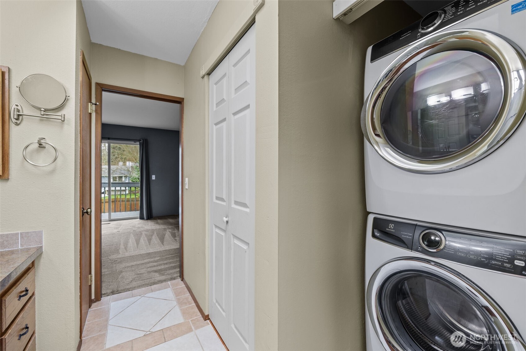 21641 Southeast 266th Street Maple Valley, WA 98038 - Photo 22 of 40 a view of a hallway with washer and dryer