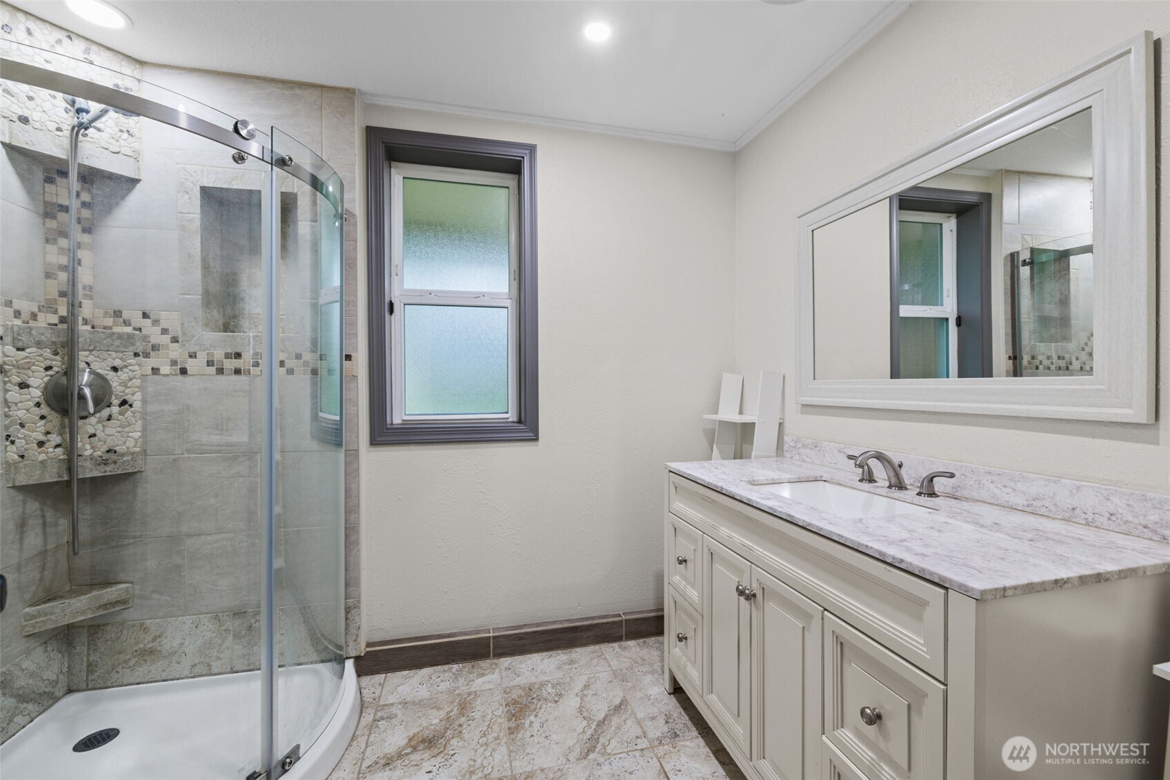 21641 Southeast 266th Street Maple Valley, WA 98038 - Photo 23 of 40 a bathroom with a granite countertop sink a mirror and shower