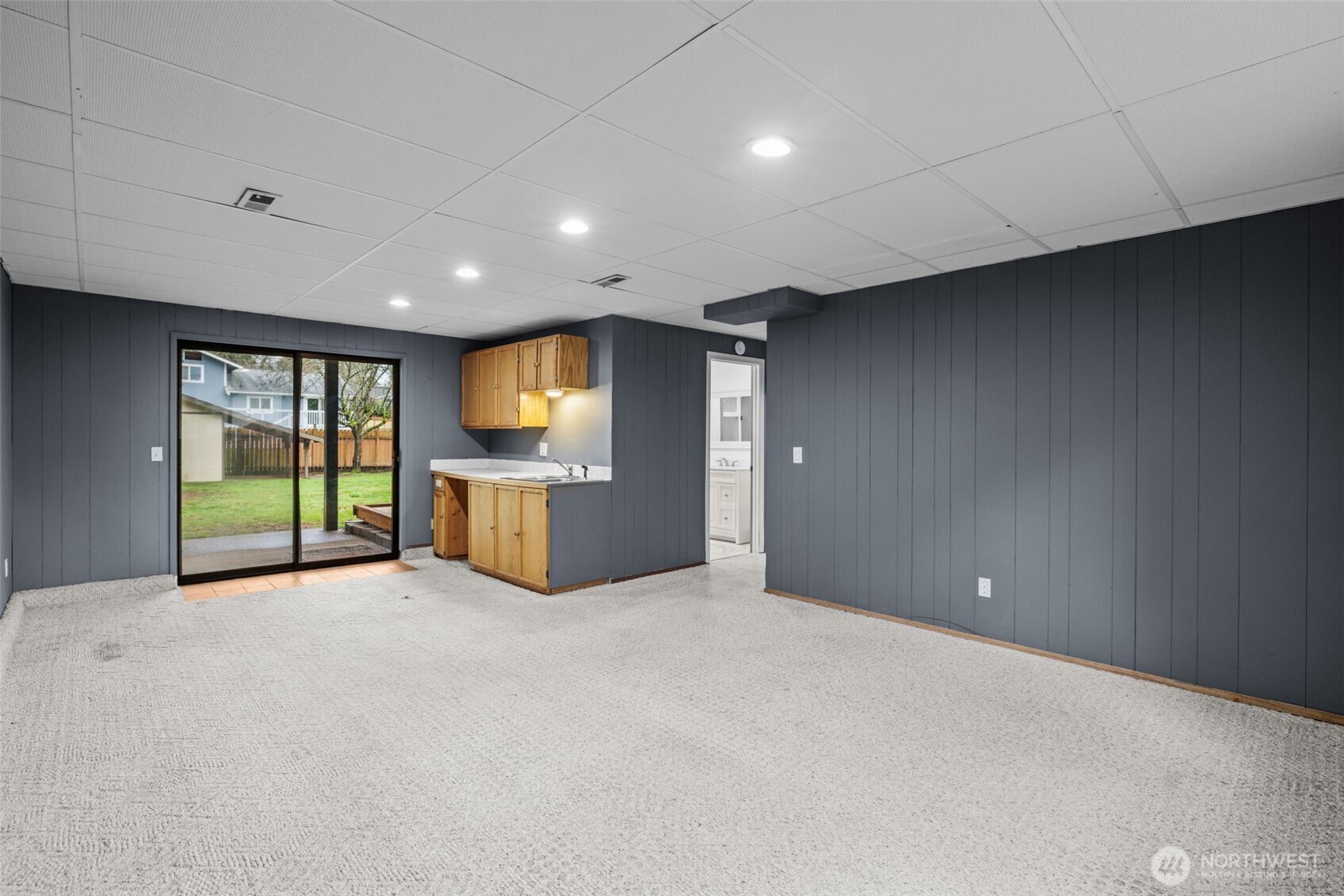 21641 Southeast 266th Street Maple Valley, WA 98038 - Photo 26 of 40 a view of an empty room with a window and kitchen view