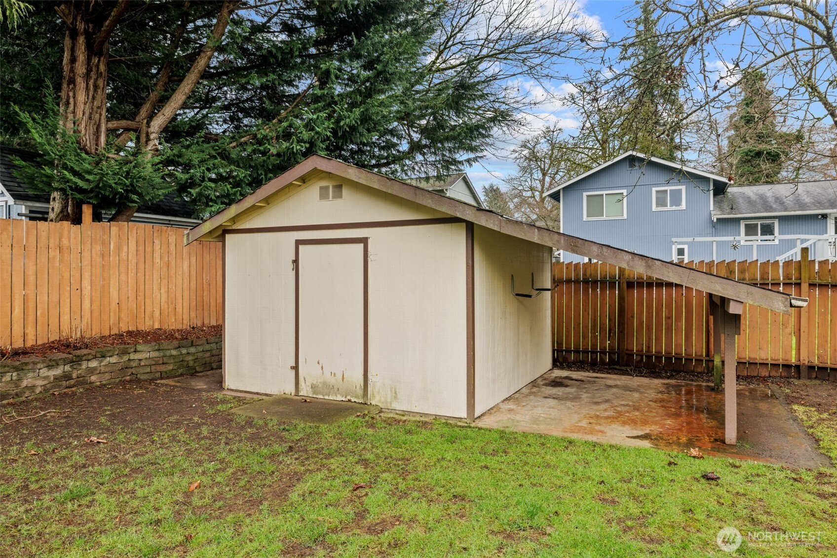 21641 Southeast 266th Street Maple Valley, WA 98038 - Photo 35 of 40 a front view of a house with a yard and garage
