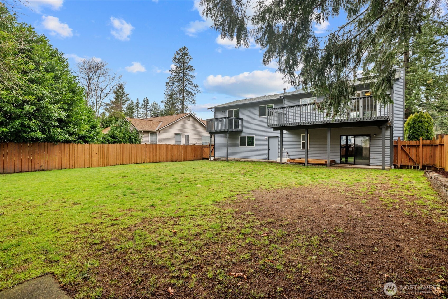 21641 Southeast 266th Street Maple Valley, WA 98038 - Photo 36 of 40 a view of a house with a yard