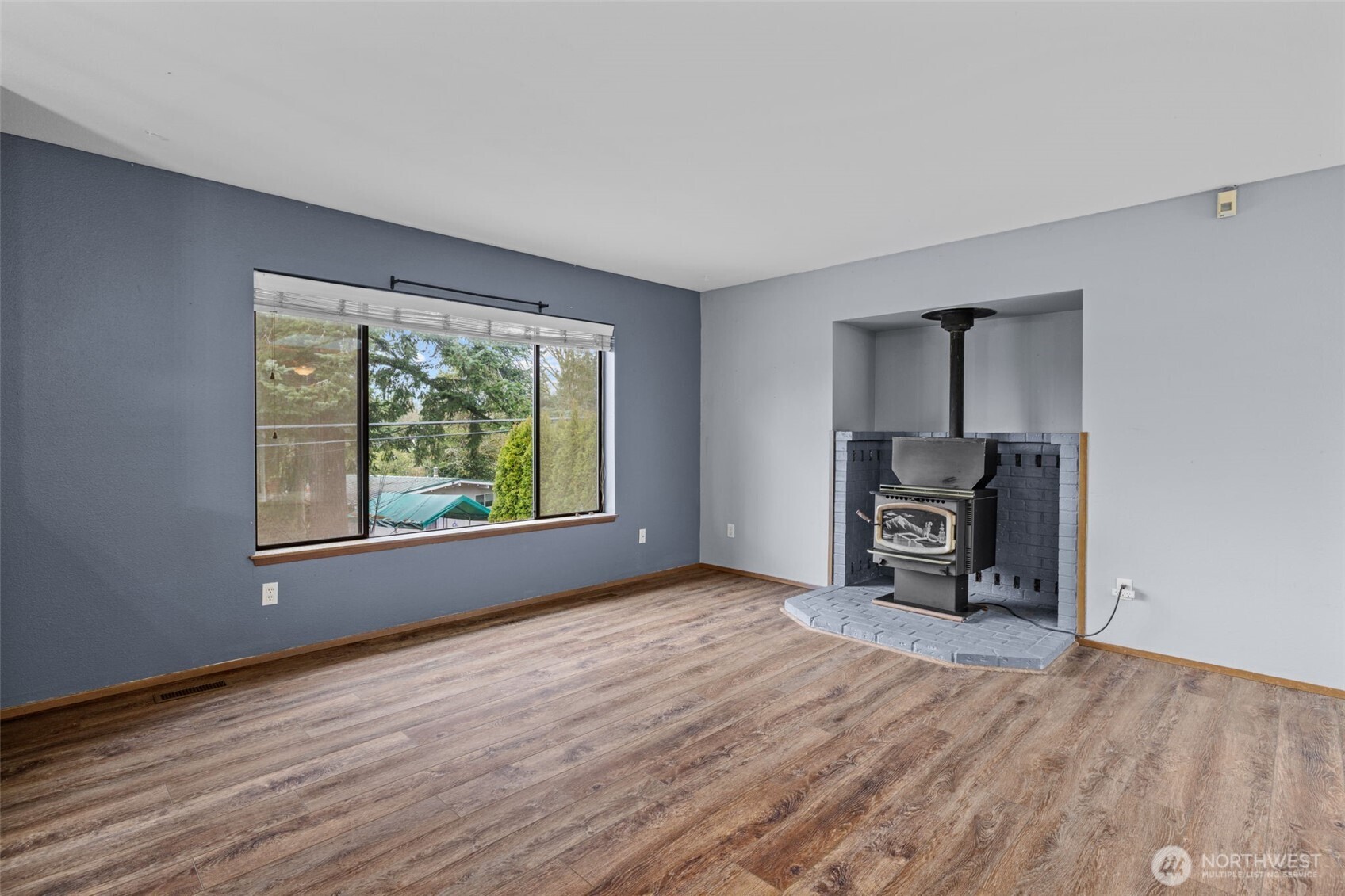 21641 Southeast 266th Street Maple Valley, WA 98038 - Photo 6 of 40 a view of a bedroom with furniture and window