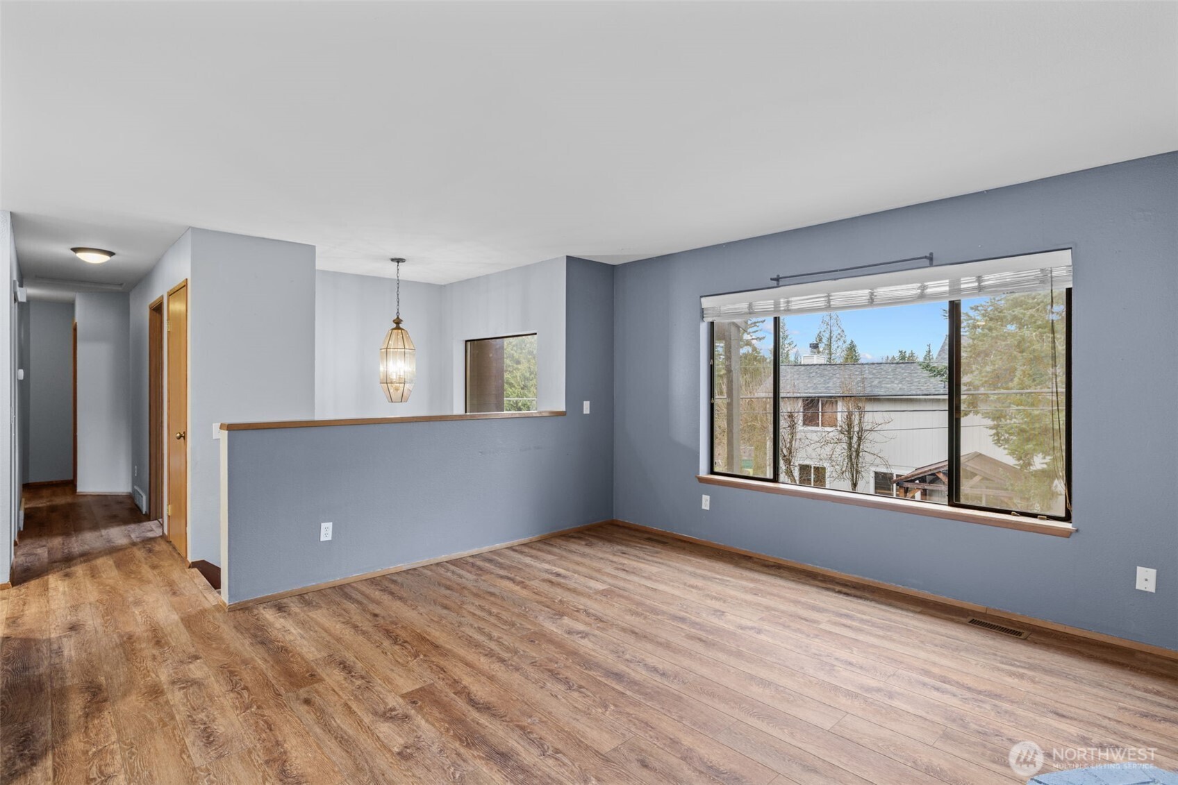 21641 Southeast 266th Street Maple Valley, WA 98038 - Photo 7 of 40 a view of an empty room with a window