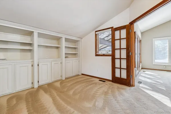a view of empty room with windows
