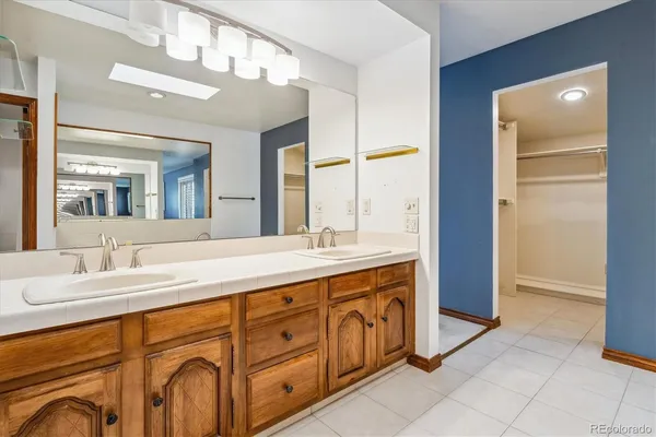 a bathroom with a sink double vanity and a mirror
