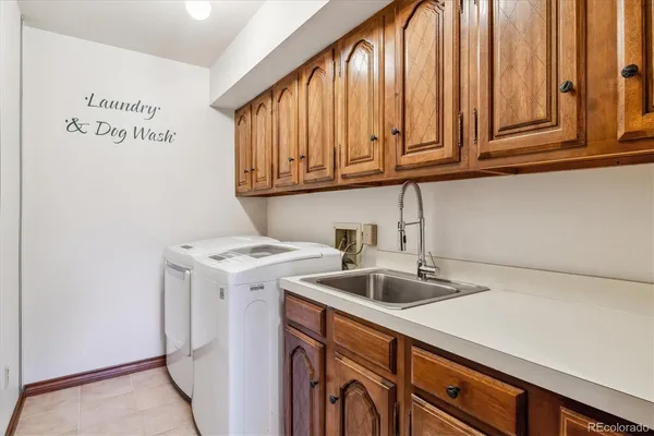 a kitchen with a sink cabinets and utility