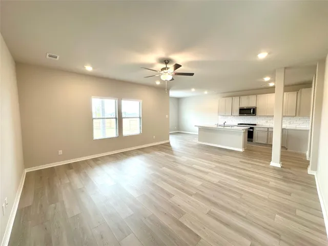an aerial view of a swimming pool patio and outdoor seating