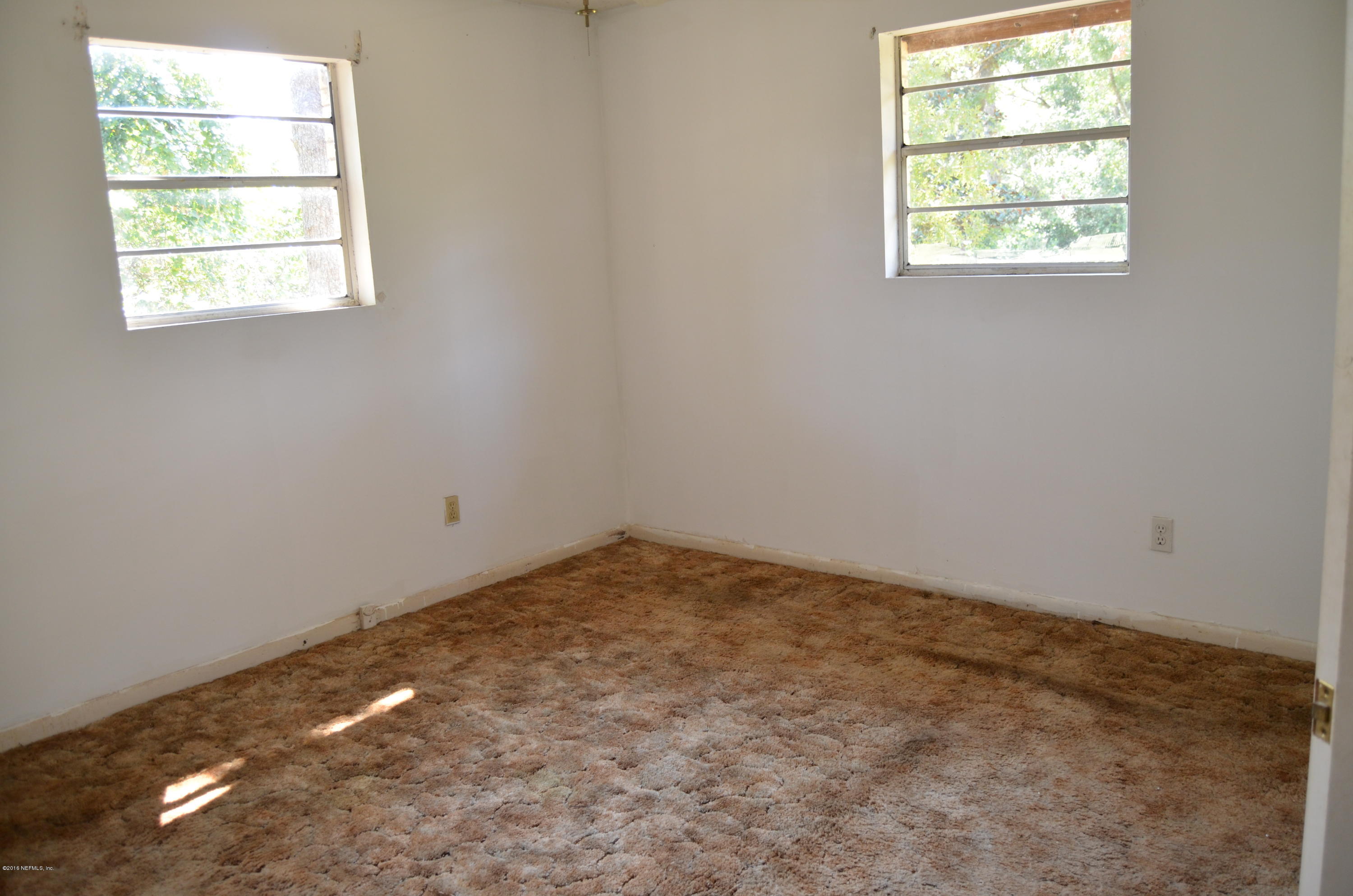 96633 Chester Road Yulee, FL 32097 - Photo 12 of 17 an empty room with a window