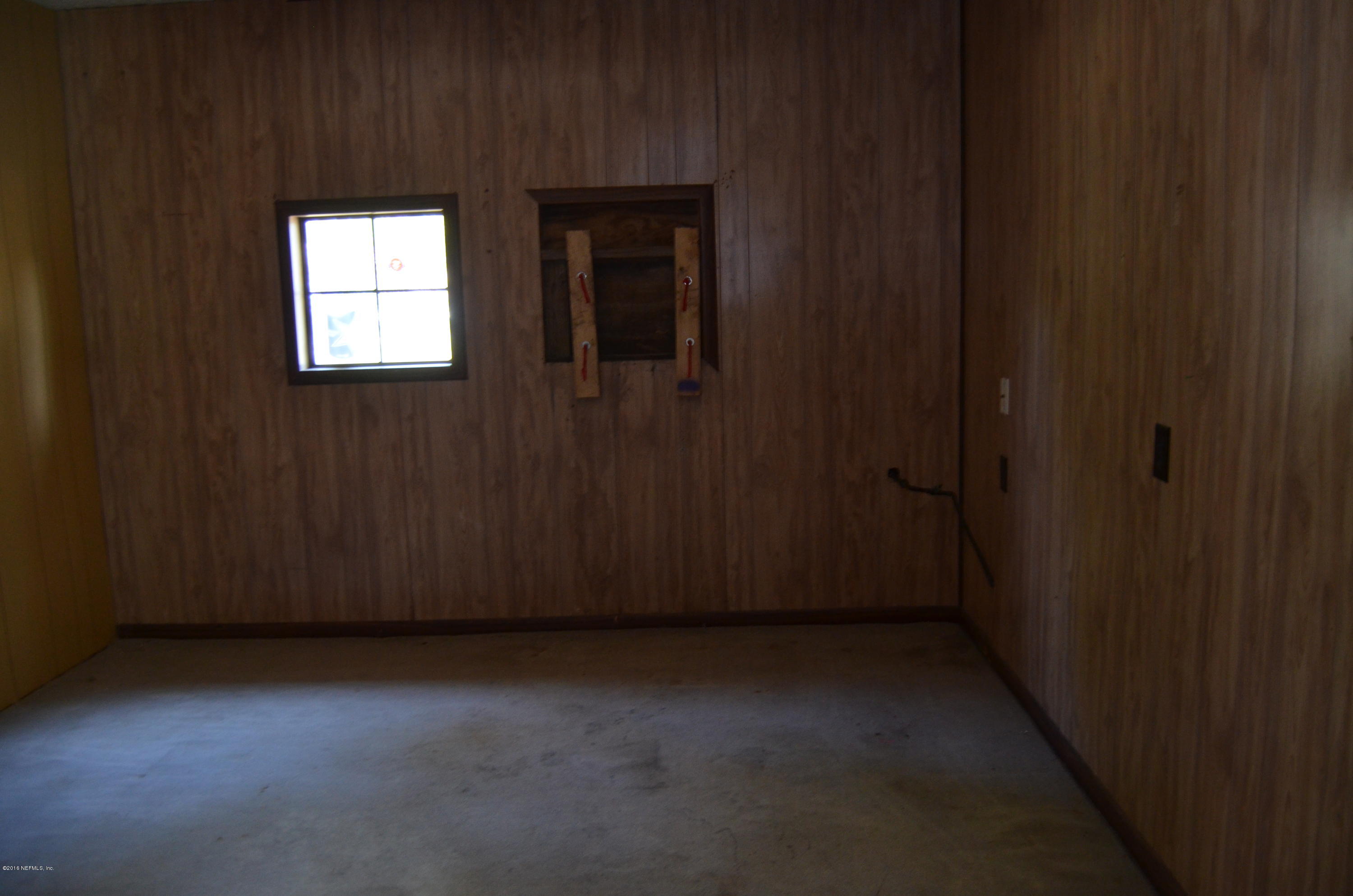 96633 Chester Road Yulee, FL 32097 - Photo 17 of 17 a view of an empty room with a window