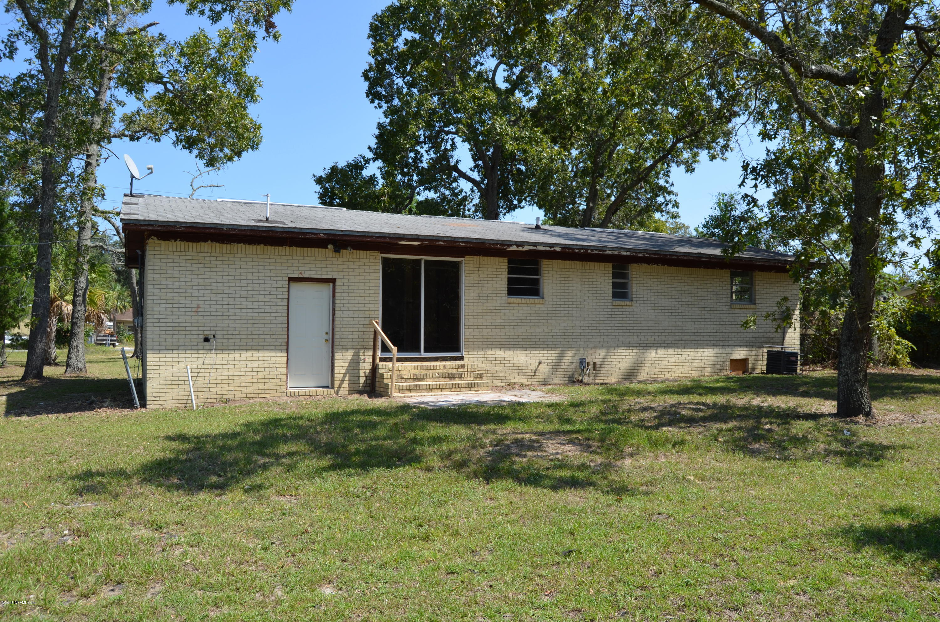 96633 Chester Road Yulee, FL 32097 - Photo 5 of 17 a house view with a garden space