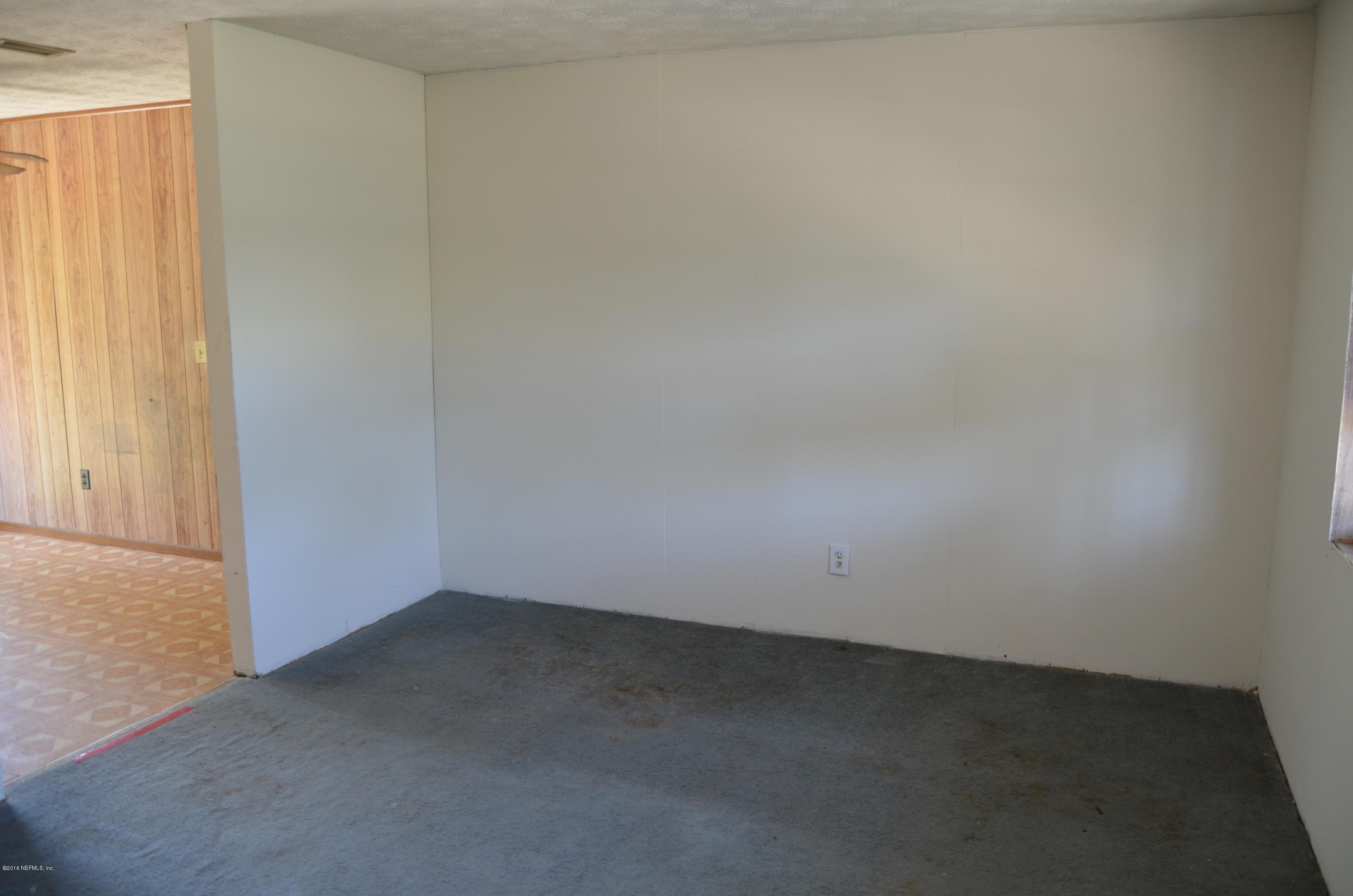 96633 Chester Road Yulee, FL 32097 - Photo 6 of 17 an empty room with a empty space