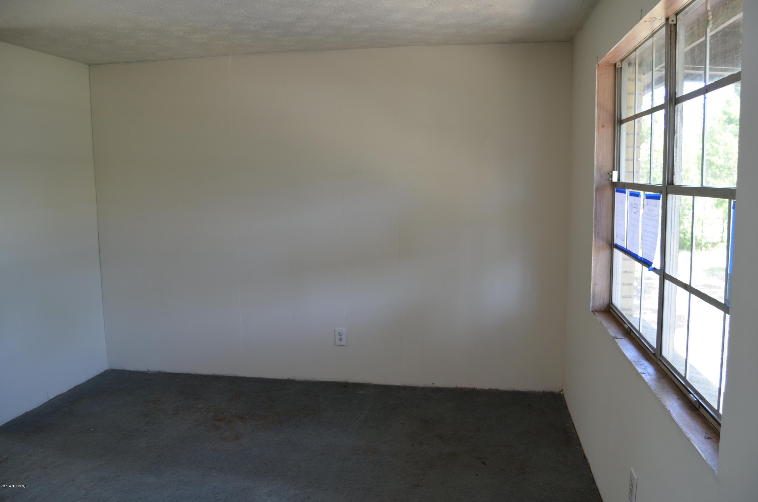 96633 Chester Road Yulee, FL 32097 - Photo 7 of 17 an empty room with a window