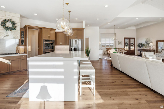 534 East Fish Hatchery Road Mantua, UT 84324 - Photo 85 of 87 Kitchen with open floor plan, a breakfast bar area, wood finish cabinets, and a spacious island