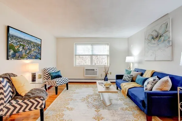 a living room with furniture and a window