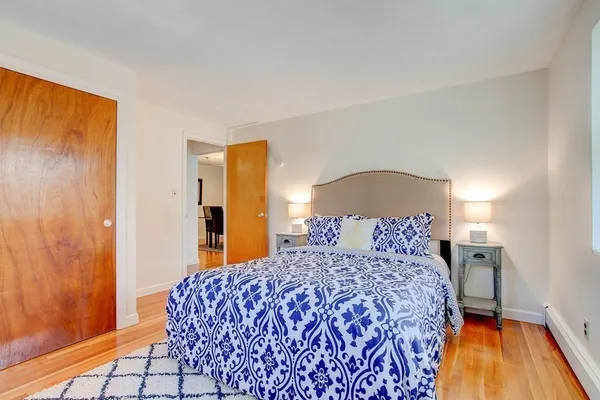 a bedroom with a bed and a dresser