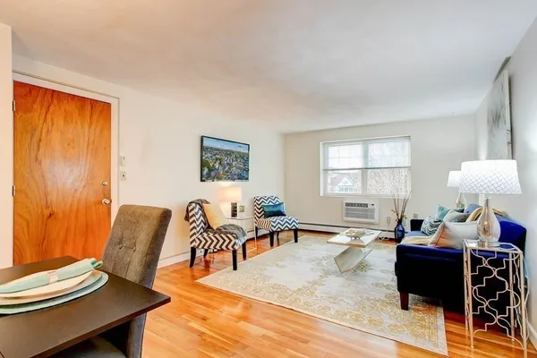 a living room with furniture and a window