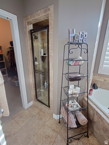 552 Sunset Crest Way Draper, UT 84020 - Photo 23 of 68 Full bath featuring a walk in closet, a bath, and a shower stall