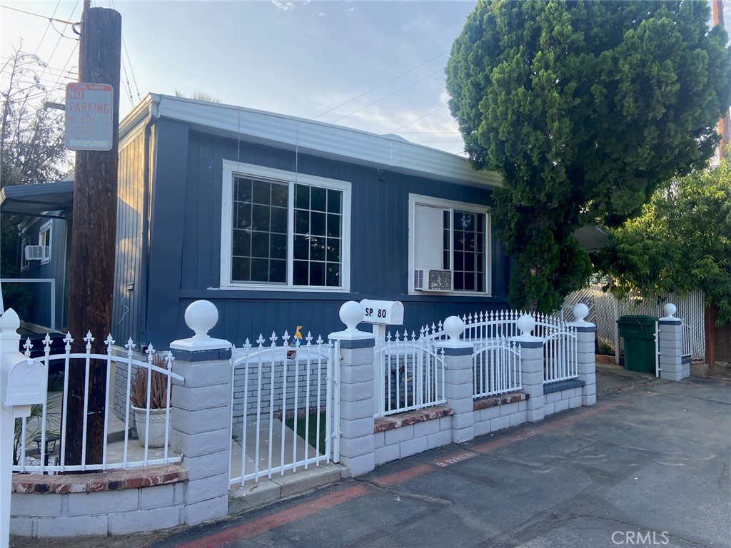 5803 Mission, Unit 80 Riverside, CA 92509 - Photo 1 of 1 front view of house with barbeque grill and plants