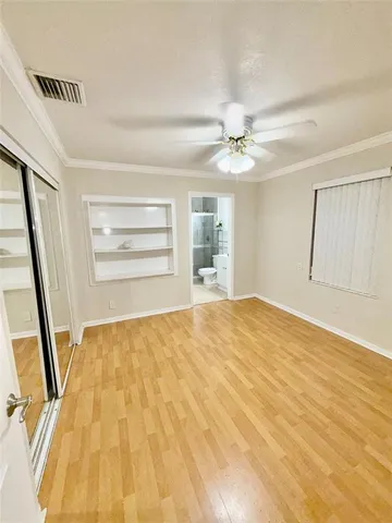 a spacious bathroom with a double vanity sink mirror and shower