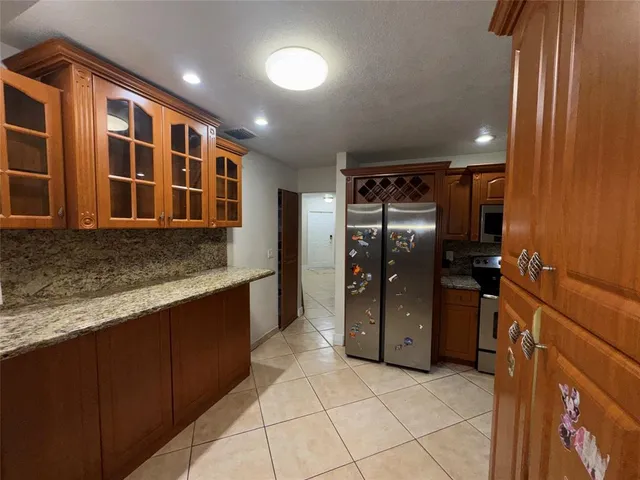 a bathroom with a sink mirror and toilet