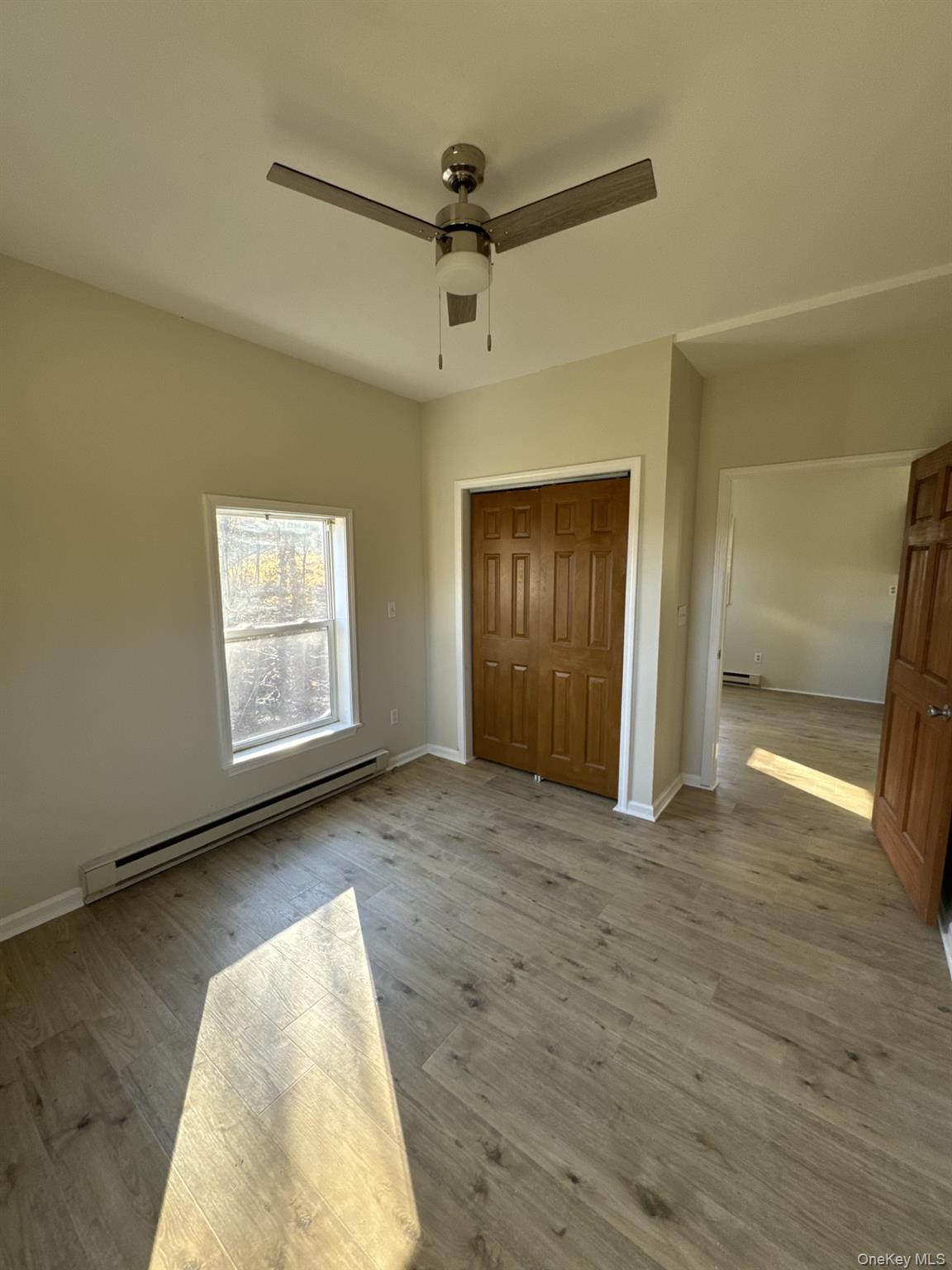 400 Round Lake Road, Unit A Rhinebeck, NY 12572 - Photo 7 of 11 an empty room with windows and closet