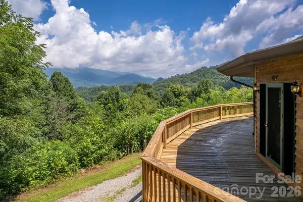 a balcony with wooden floor and fence