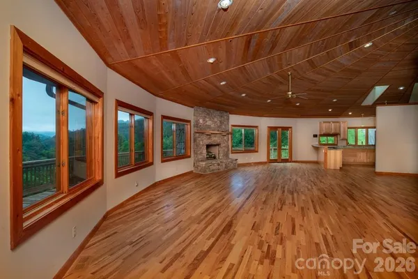 a view of a hall with wooden floor