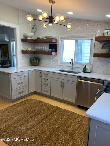 a kitchen with a sink cabinets and window