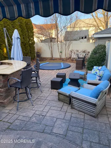 a outdoor space with lots of white furniture