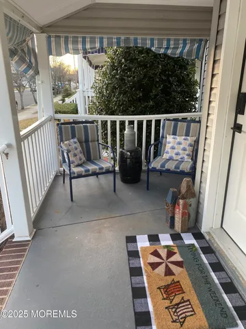 a view of balcony with furniture