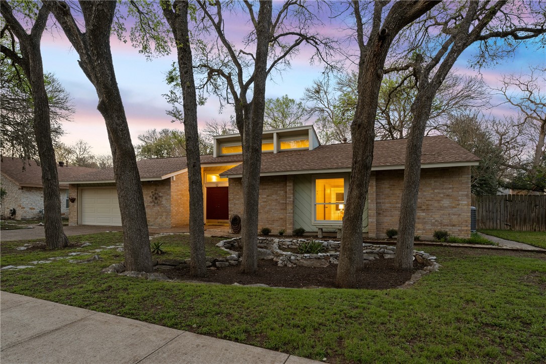 4831 Trail Crest Circle Austin, TX 78735 - Photo 1 of 1 a view of a house with a backyard