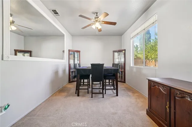 a view of a dining room with furniture