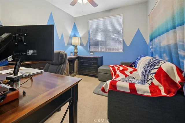 a bed room with a bed and a desk