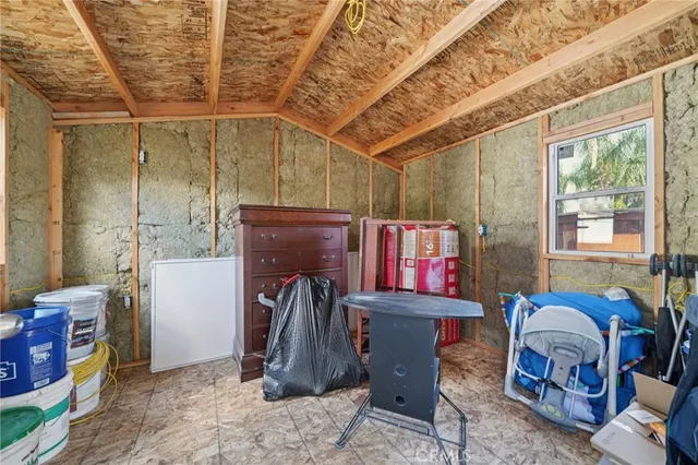 a view of a porch with chairs and backyard