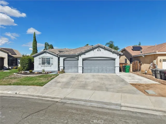 a view of the house with a yard
