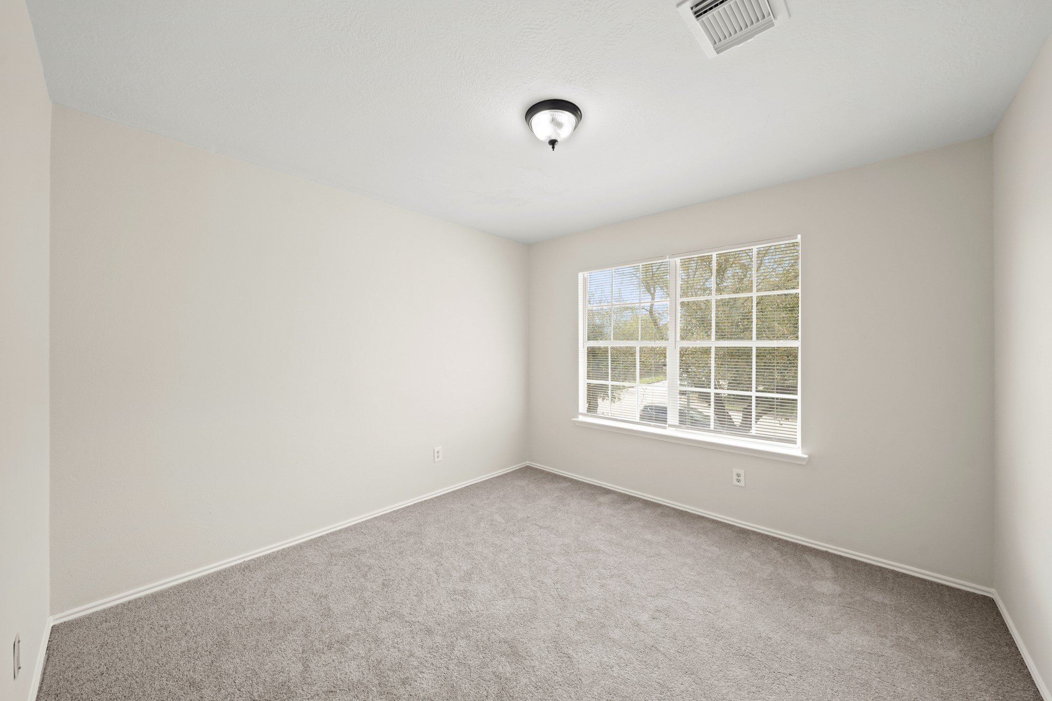 1426 Cartwright Road Missouri City, TX 77489 - Photo 16 of 26 an empty room with a window