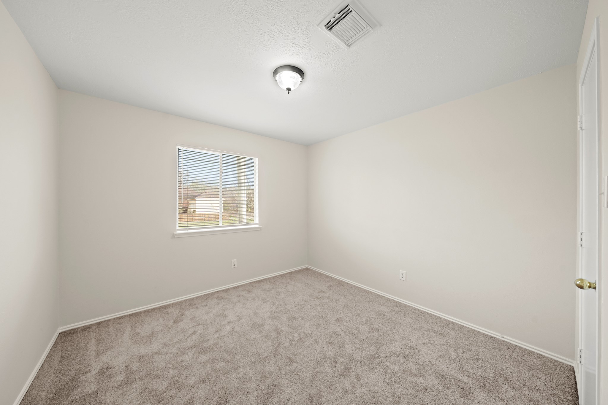 1426 Cartwright Road Missouri City, TX 77489 - Photo 17 of 26 an empty room with a window