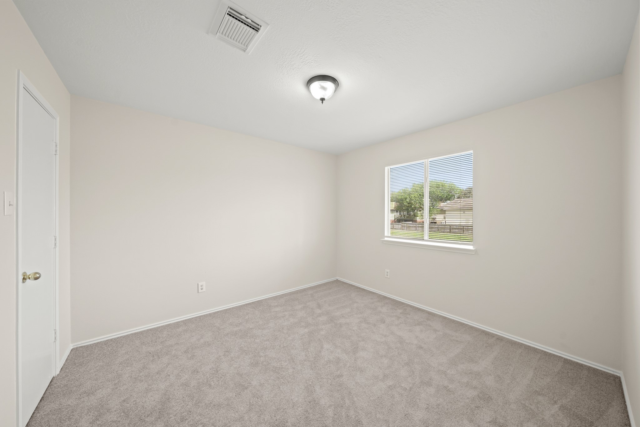 1426 Cartwright Road Missouri City, TX 77489 - Photo 18 of 26 an empty room with a window