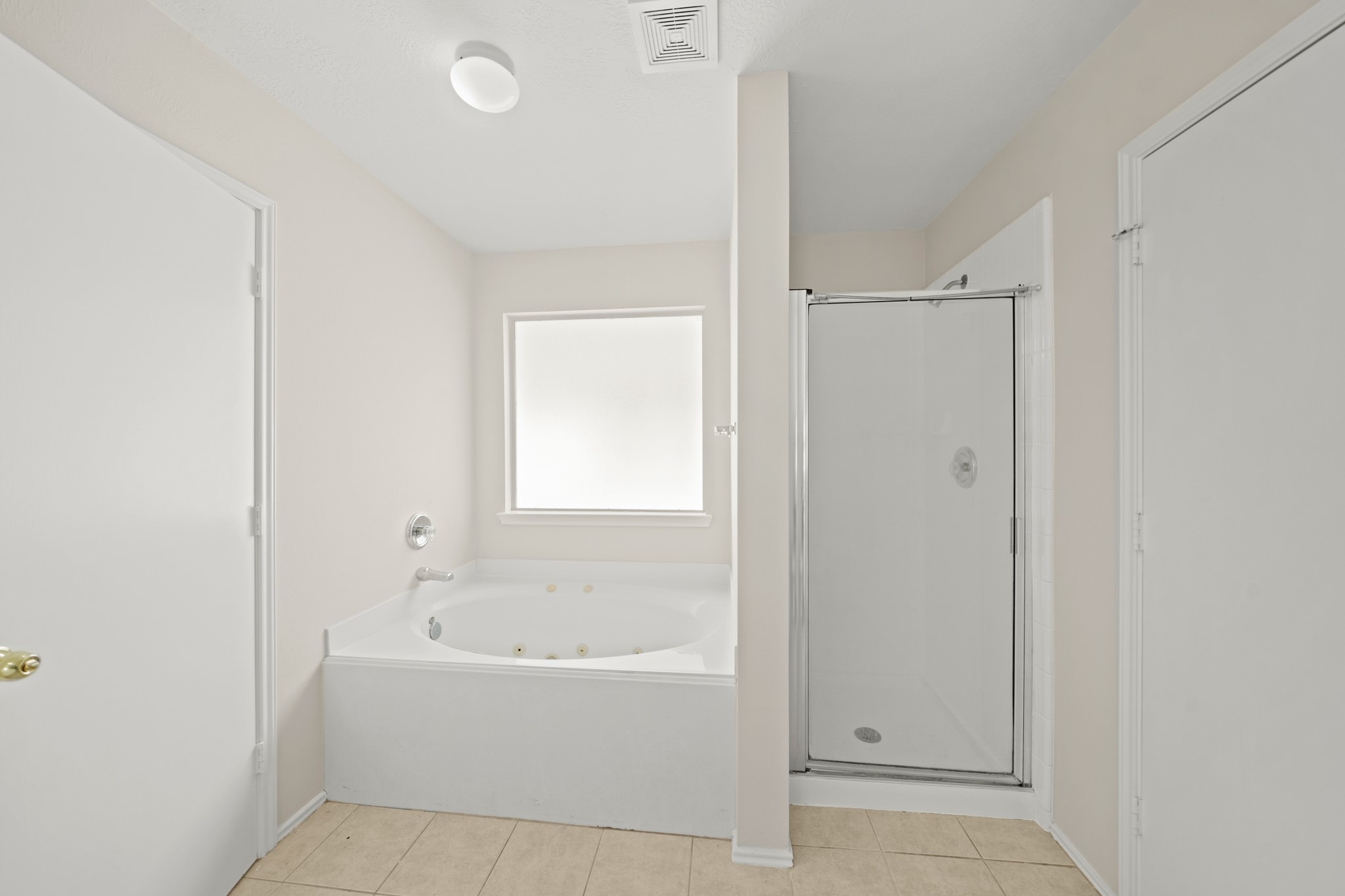 1426 Cartwright Road Missouri City, TX 77489 - Photo 24 of 26 a white bath tub sitting next to a shower