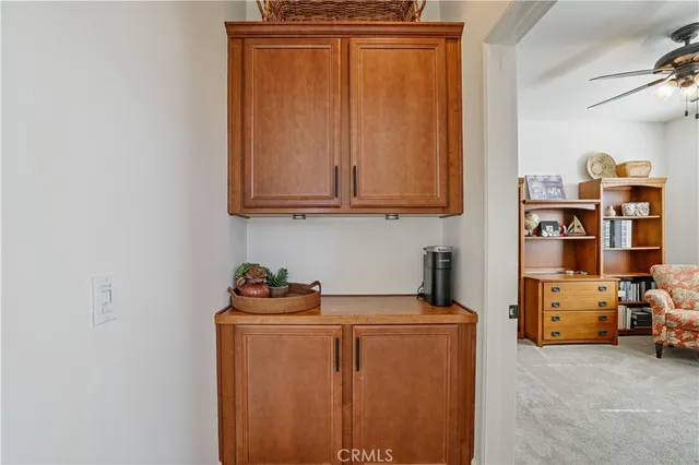 a bedroom with a bed and a flat tv screen on the dresser