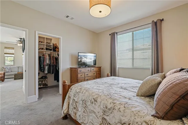 a view of a patio with a table chairs and a garden