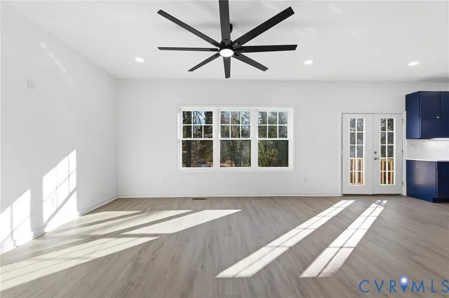 a kitchen with kitchen island a sink stainless steel appliances and cabinets