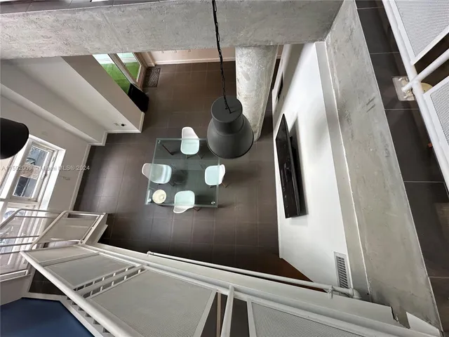 a view of staircase with wooden floor