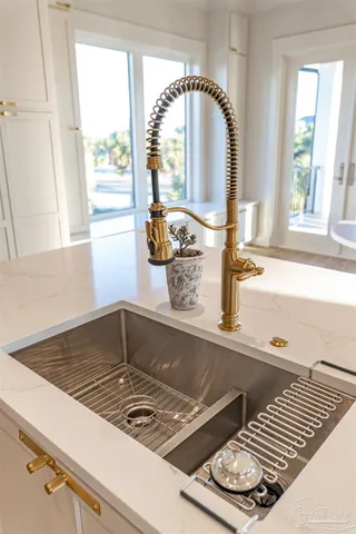 a view of a walk in closet with empty racks