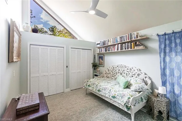 a bedroom with a bed and a couch