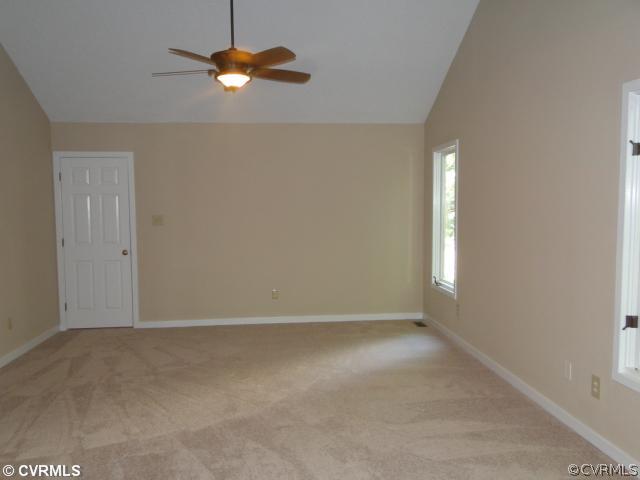 15000 Walnut Bend Road Midlothian, VA 23112 - Photo 14 of 24 a view of an empty room with window and chandelier fan