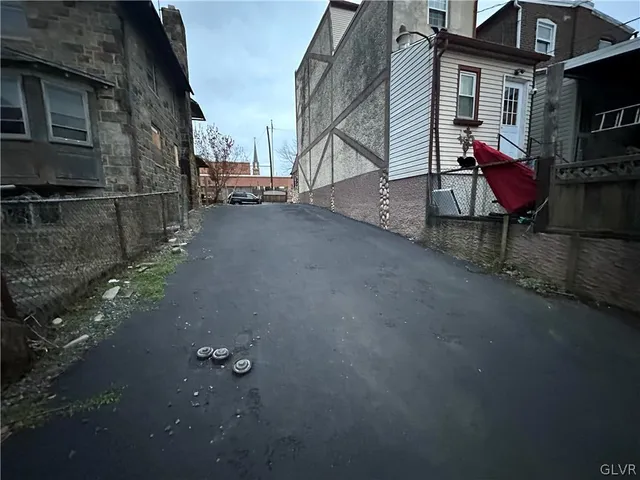 a view of a street with sitting area