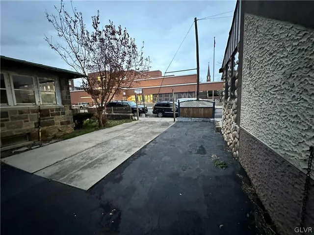 a view of a backyard with sitting area