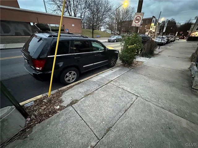 a car parked in front of a house